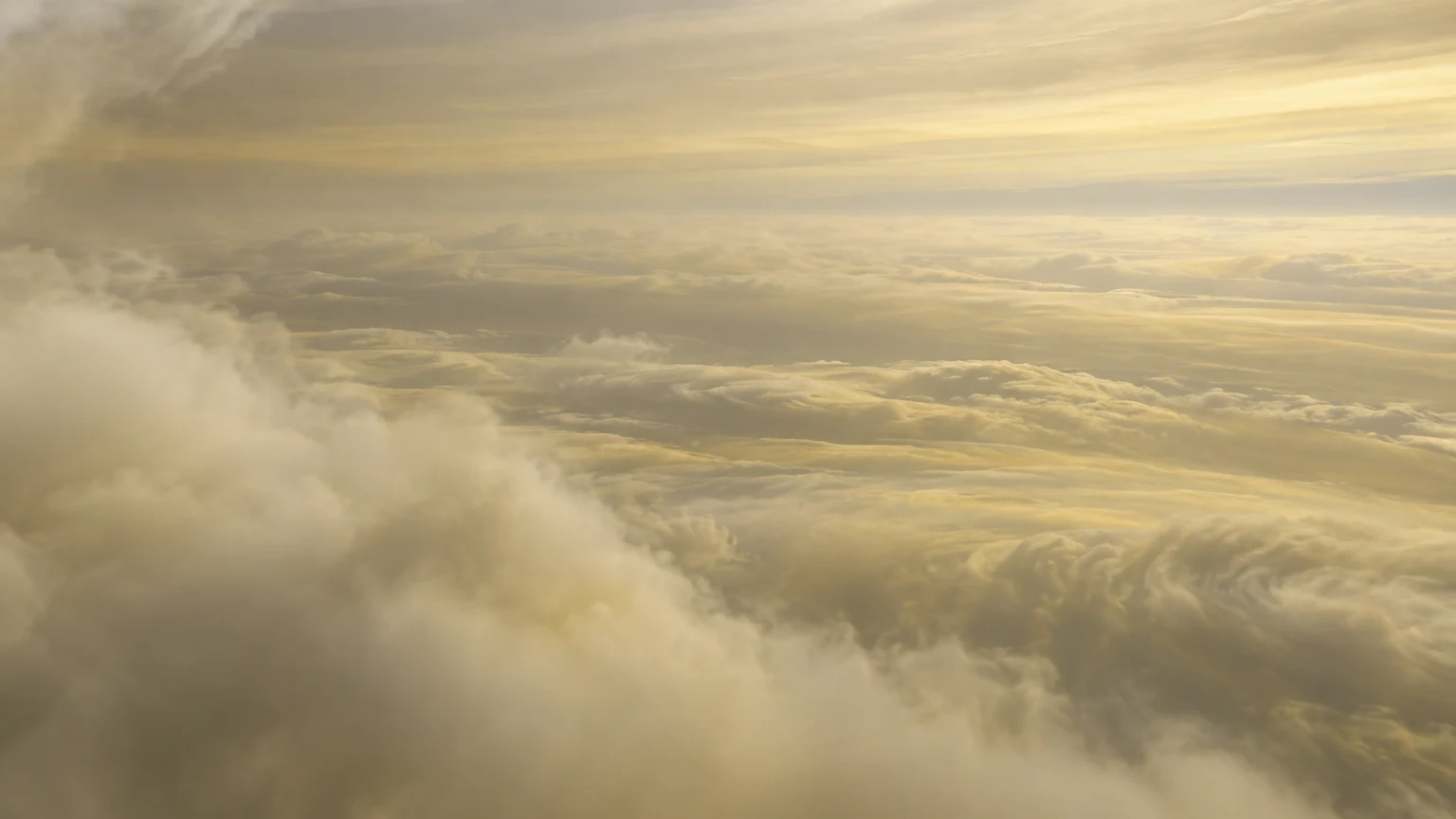 An imagined floating viewpoint among Saturn’s pale upper cloud layers. Haze limits the view; lighting, altitude and small cloud forms are interpretive. There is no solid ground.